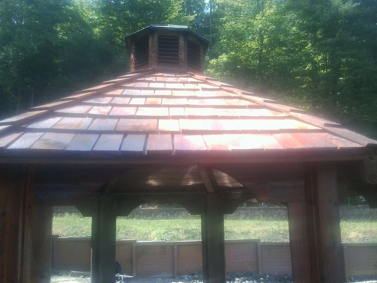 New cedar shake roof and cupola on a lakeside gazebo in Packwood